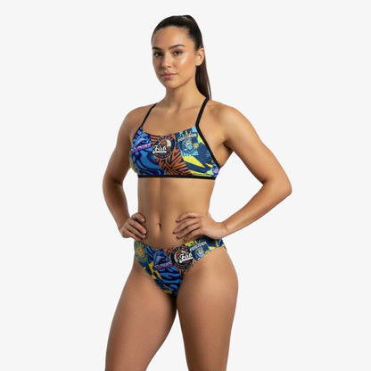 Woman wearing a colorful bikini with a white background